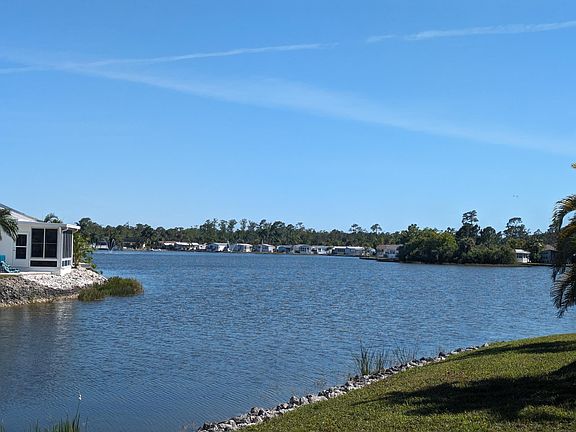 BACKYARD: Lake front
The white lanai to the left is our house from the club house pool.
