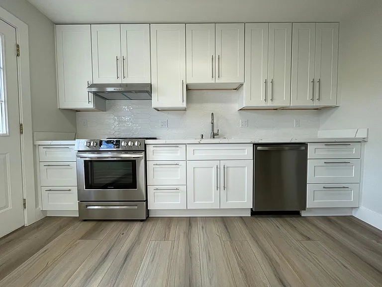 Unit 413 has refinished hardwood flooring rather than LVT like this unit 417