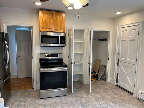 Kitchen to show induction stove and closet space