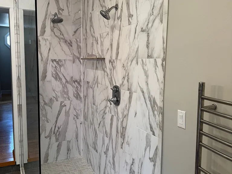 Double shower heads in stall