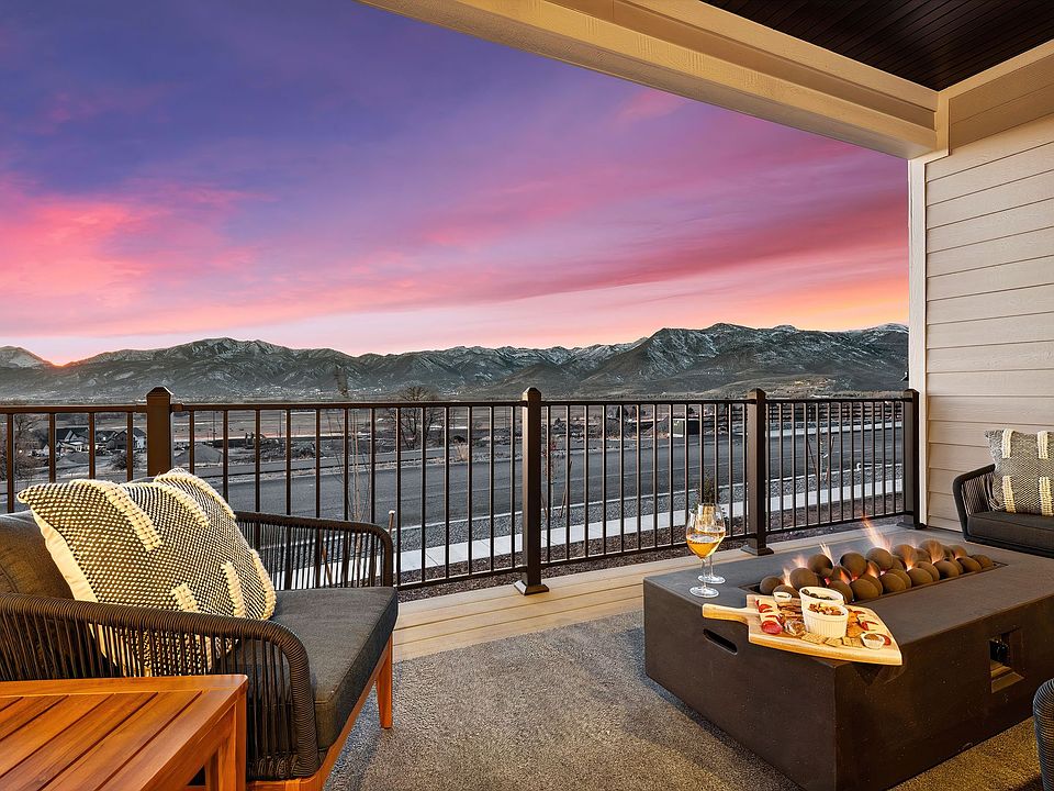 Upstairs covered patio off of the kitchen and living room. And those views of The Mount Timpanogos Range.