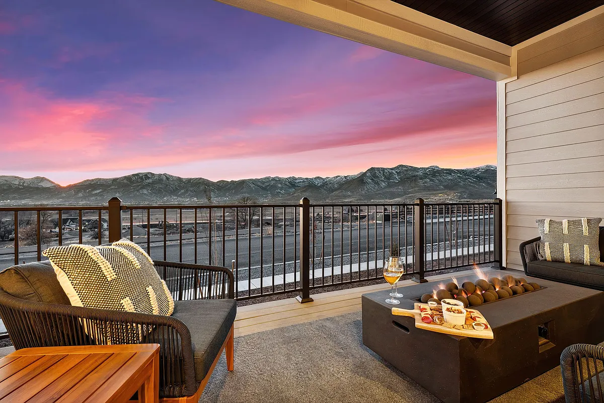 Upstairs covered patio off of the kitchen and living room. And those views of The Mount Timpanogos Range. - 2141 N Coyote Bend Way