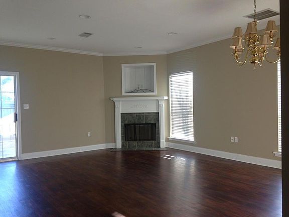 Big living room with a"" Beautiful"" fireplace.