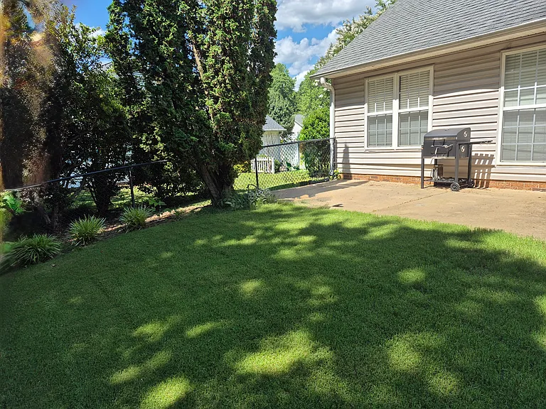 Private feeling and quiet fenced backyard. Easy care. Great for small children.