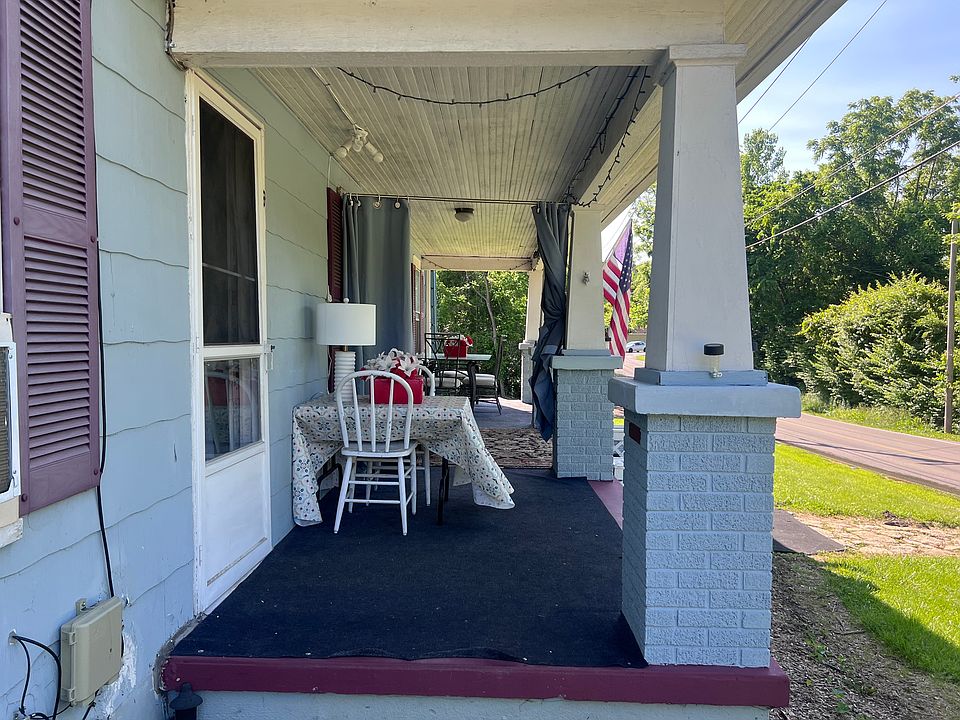 Ground level private entrance, front porch sitting area with privacy curtains