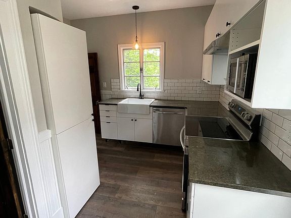 Kitchen has large farm-style sink