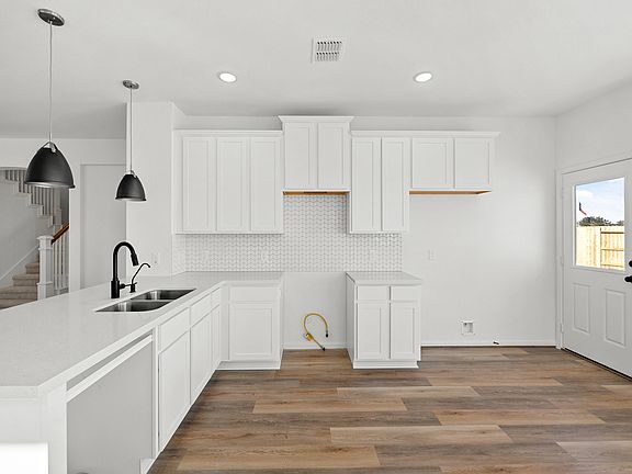 Kitchen with peninsula and pendant lighting