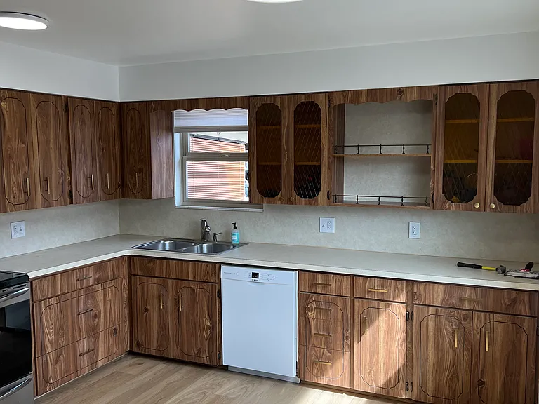 Large bright kitchen with plenty of storage and new appliances.
