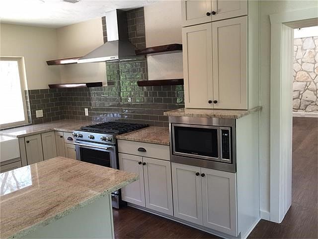 Completely new kitchen, propane slide in stove, apron sink, many cabinets.