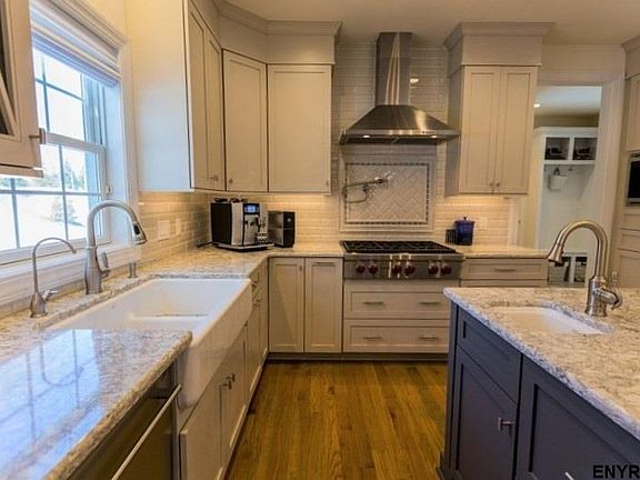 SubZero refrigerator, beverage fridge, Asko DW microwave, double ovens (convection & conventional).