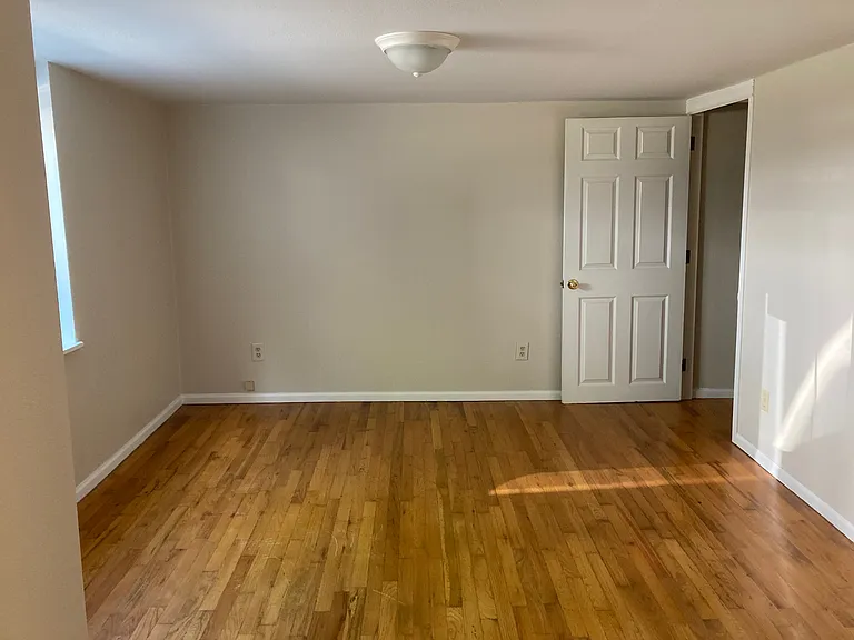 This bedroom also has a nicely finished storage area under the stairs, as well as a large closet.