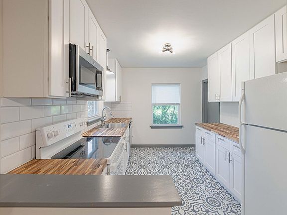 New kitchen featuring 42 inch kitchen cabinets and some stainless steel appliances. Lots of natural light.