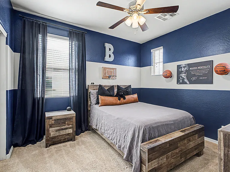 The second upstairs bedroom features a nautical color palette with a fun basketball theme, making it perfect for a young boy. If preferred, the room can easily be transformed to match your own style and needs.