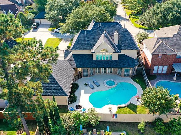 This amazing aerial shot shows a great view of the roof that was replaced in 2015! PLUS the home is brick on all four sides w/ s