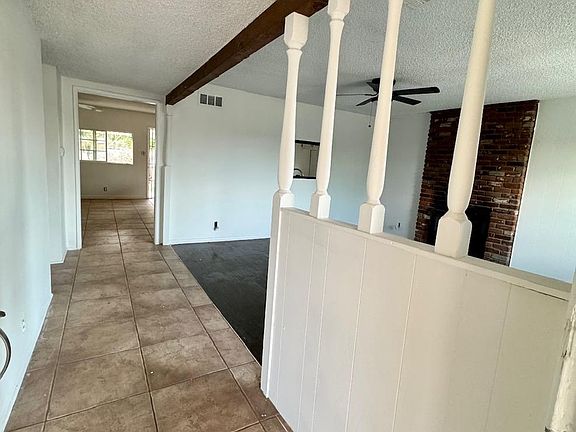entry way into living room with view of dining area down the hall