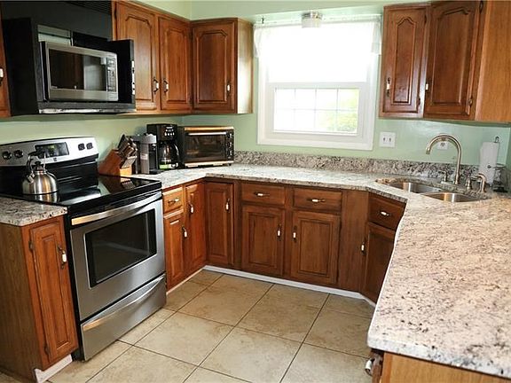 Kitchen with stainless steel appliances and Granite Counter tops