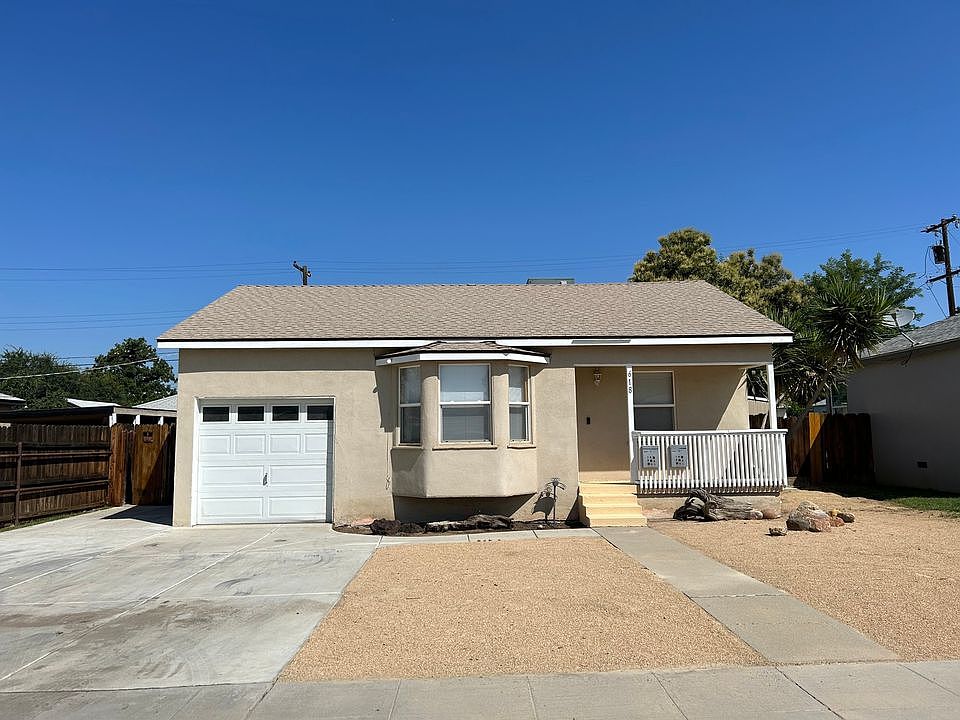 Charming NE home with attached garage, 2 off street parking spots, bay window for lots of light.