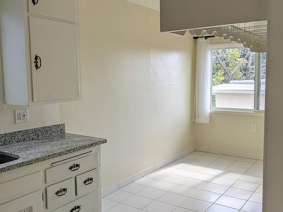 Kitchen to spacious dining or office area.