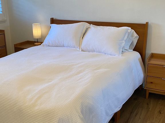 All beds have 600 thread count cotton sheets and fluffy down comforters.