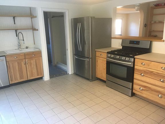 Kitchen with gas range and dishwasher.