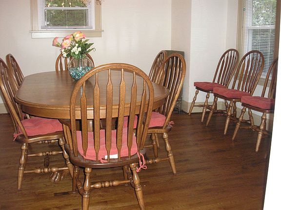 Formal Dining with Hardwood Flooring