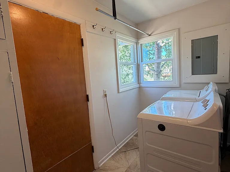 Laundry/mud room. Door to back stairs.