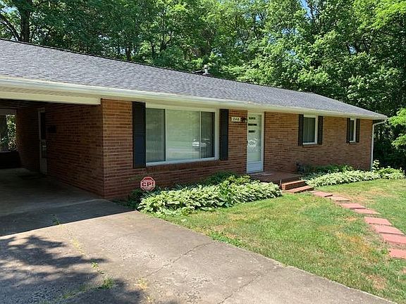 Upper driveway carport conveniently leads right into kitchen.