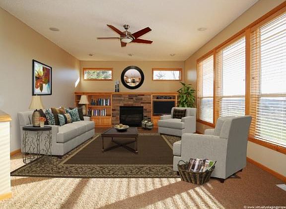 Maim floor Great room is bright and sunny, has fireplace, built-ins, wood blinds, and pillars