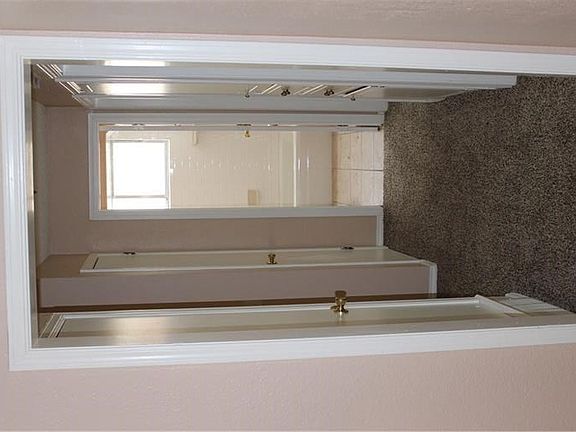 Hallway with 2 closets and built-ins