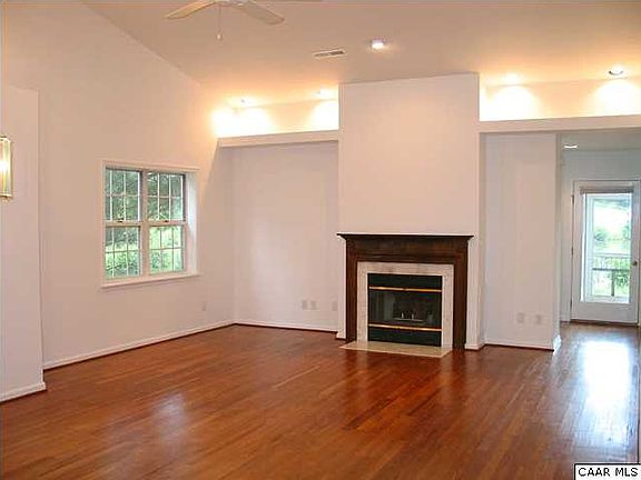 Living Room has vaulted ceiling and recess lighting
