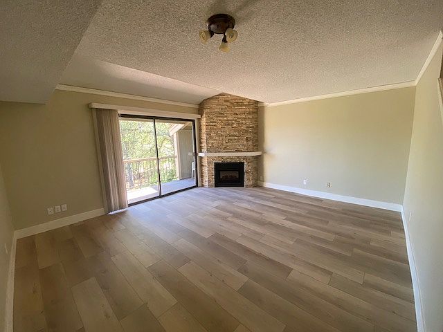 Living Room with a "View & a Balcony"!
Stacked Stone Fireplace with a easy turn on and off remote. Flooring is a rich earth tone Vinyl plank style. crown molding and updated overhead lighting.