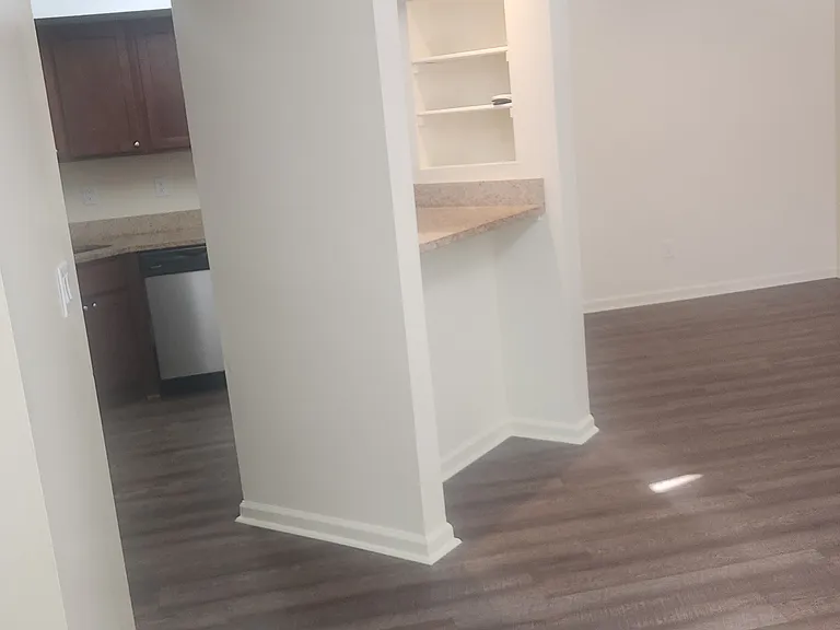 Entry facing kitchen/bar/dining room.