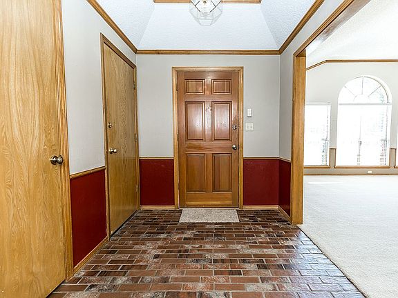 entry with brick flooring