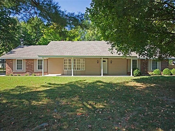 Extra large, flat yard in both front and back of this home make it feel even more charming and peaceful...