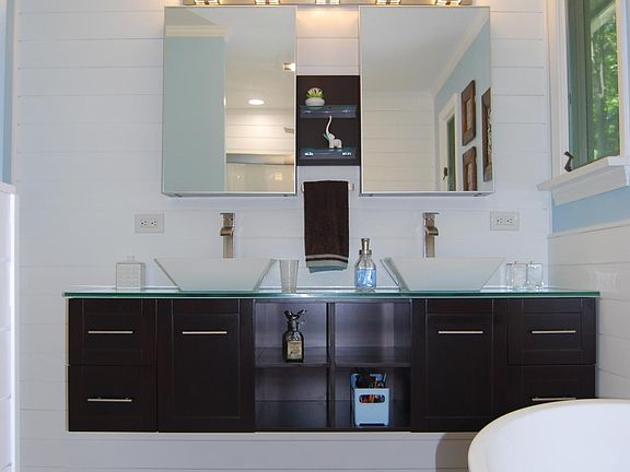 Floating Double Vanity with Vessel Sinks and Medicine Cabinets
