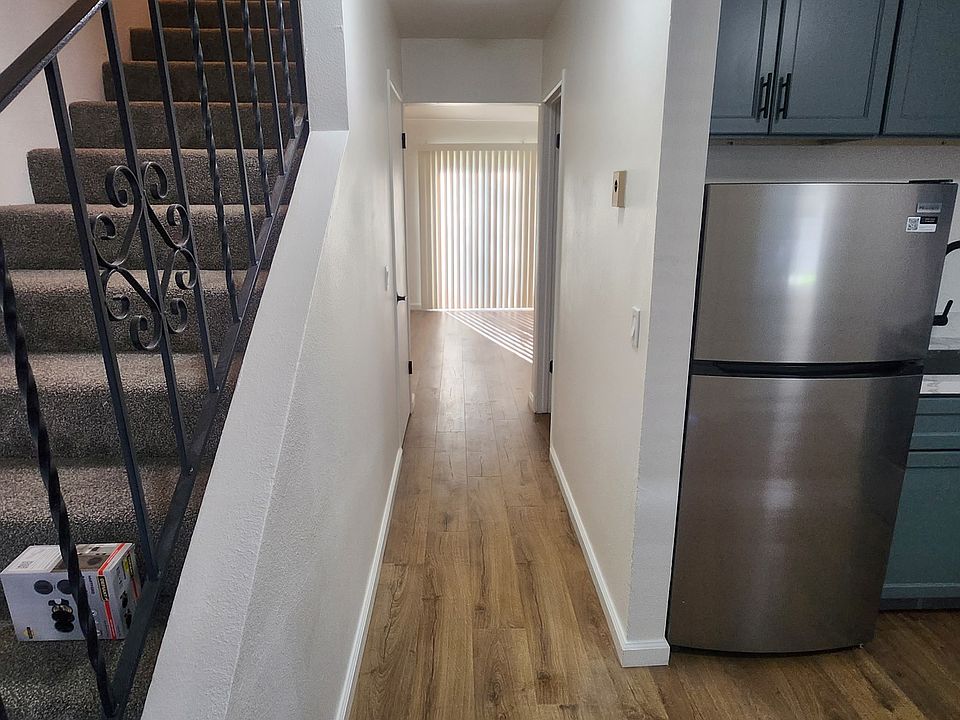 kitchen looking down the hallway. 1/2 bath on your right and living room in the back