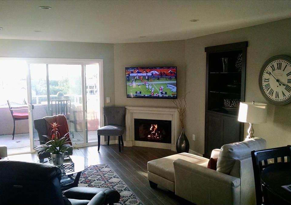 Living room with 55" HD TV and gas fireplace