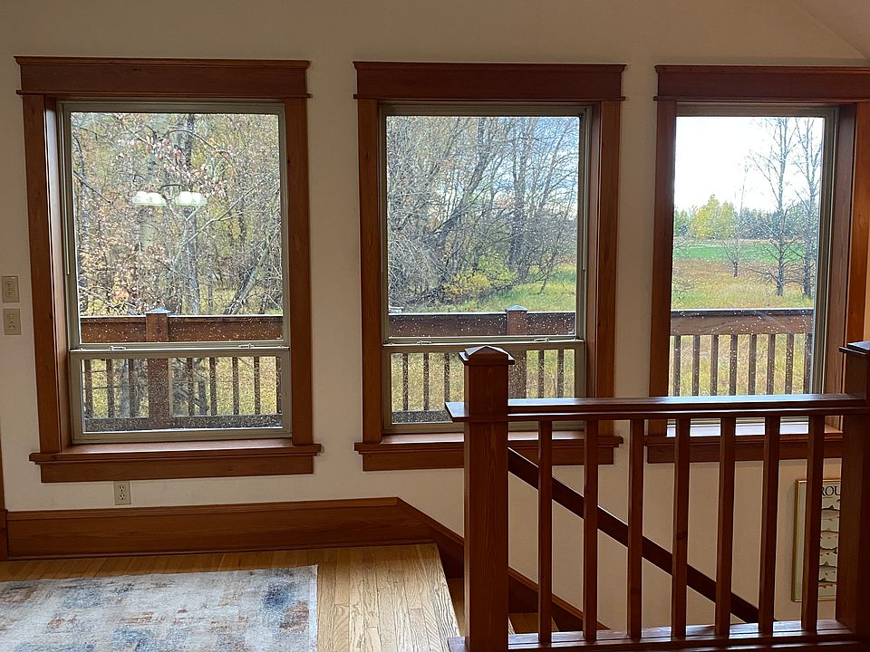 View from kitchen and living room of the property. Door to outside balcony deck.