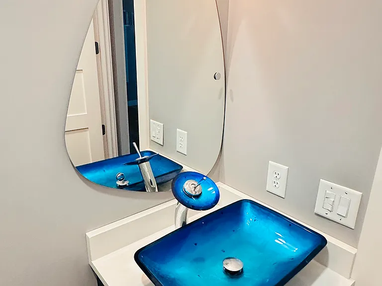 This is the artistic half bath on the first floor just off of the foyer.