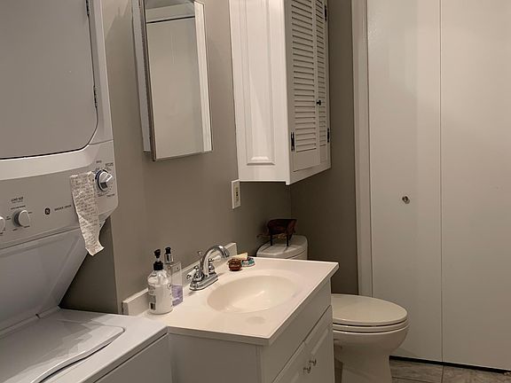 Half bathroom with laundry machine