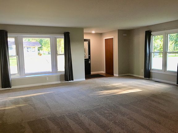 living room & foyer with coat closet