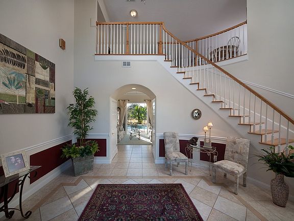 gorgeous spiral staircase foyer