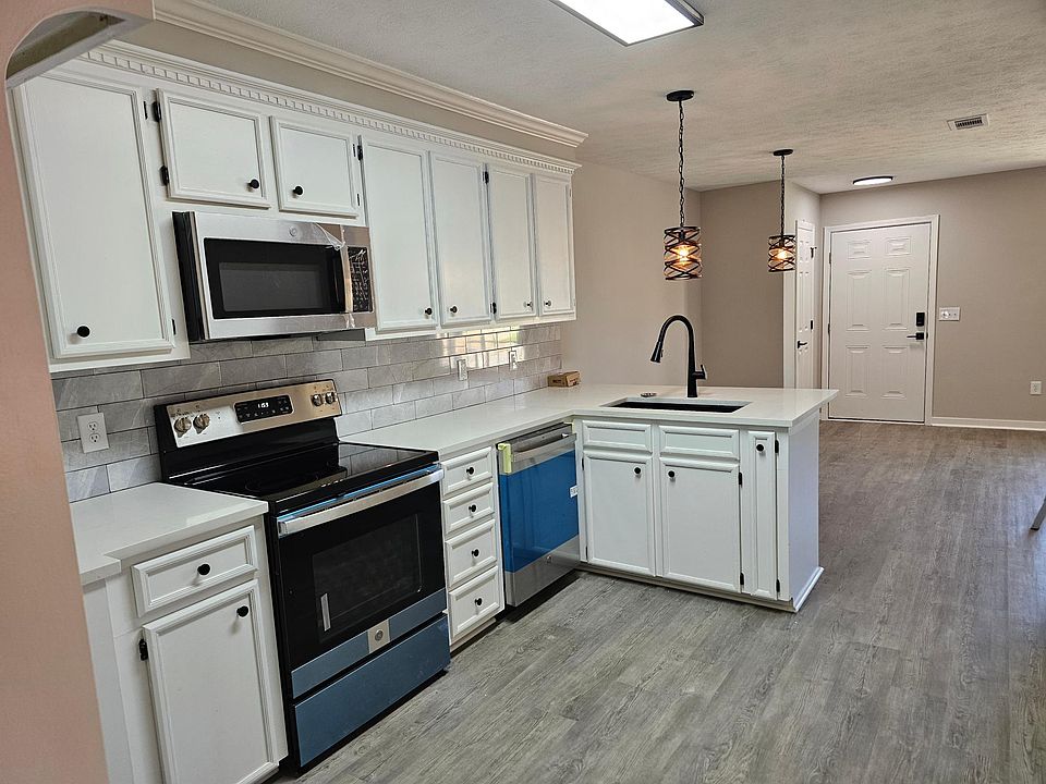 kitchen with new stainless appliances and quartz countertops