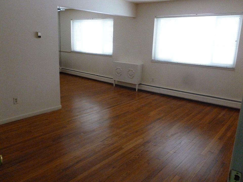 Living room facing courtyard.Newly refinished wood floors