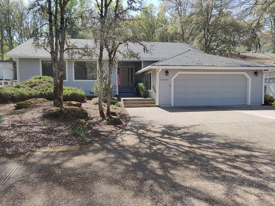 Front of house includes a generous driveway