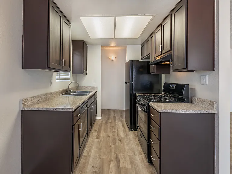 Sedona Apartments in Moreno Valley offers renovated units with updated flooring, sleek black appliances, and modern cabinets for stylish, comfortable living.