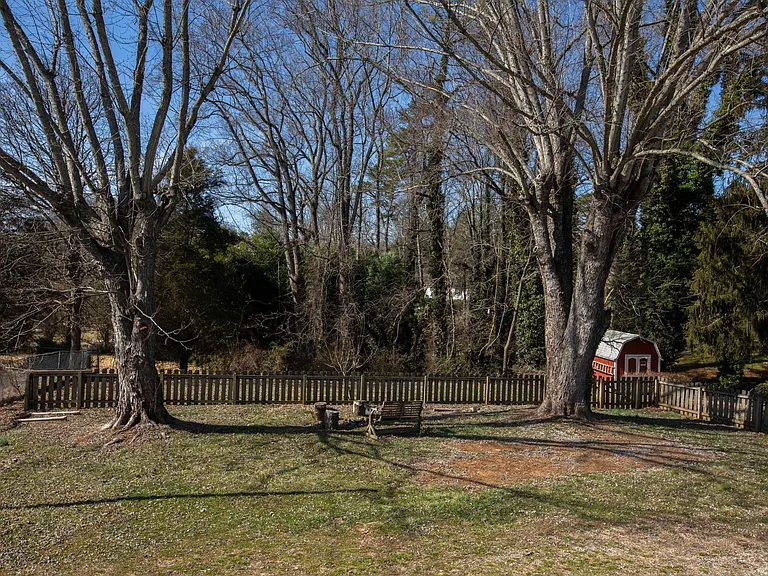 Fenced in backyard. View from the back wrap around porch.