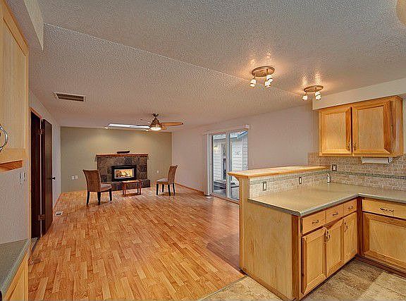 Hardwood floors and incredible gas stove make this a spectacular family room.