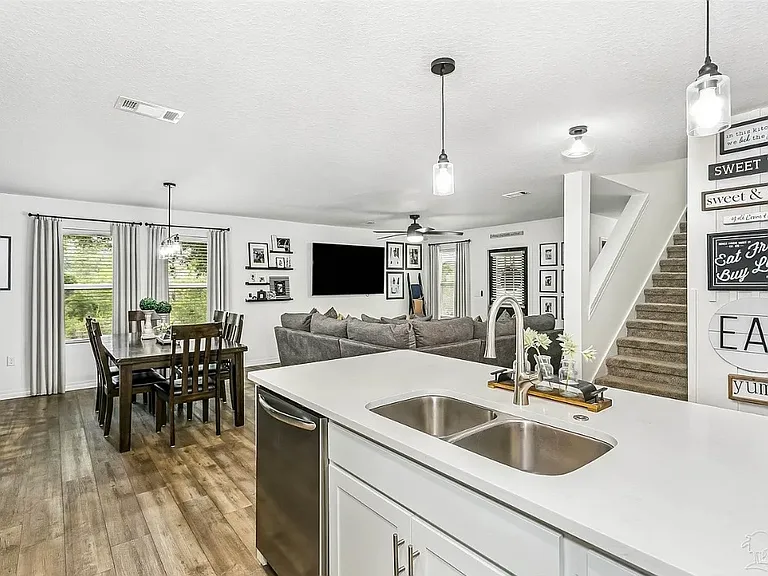 Open floor plan of kitchen, dining room and den