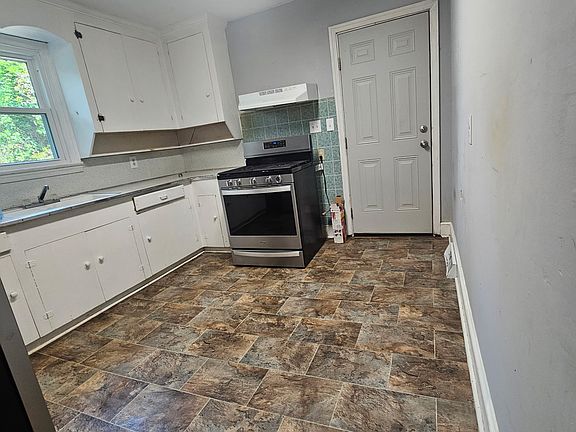 Kitchen with stainless steel appliances.
